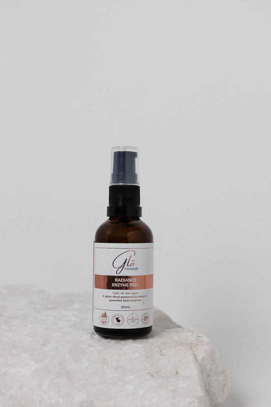 Glo Younger Radiance Enzyme Peel bottle on stone