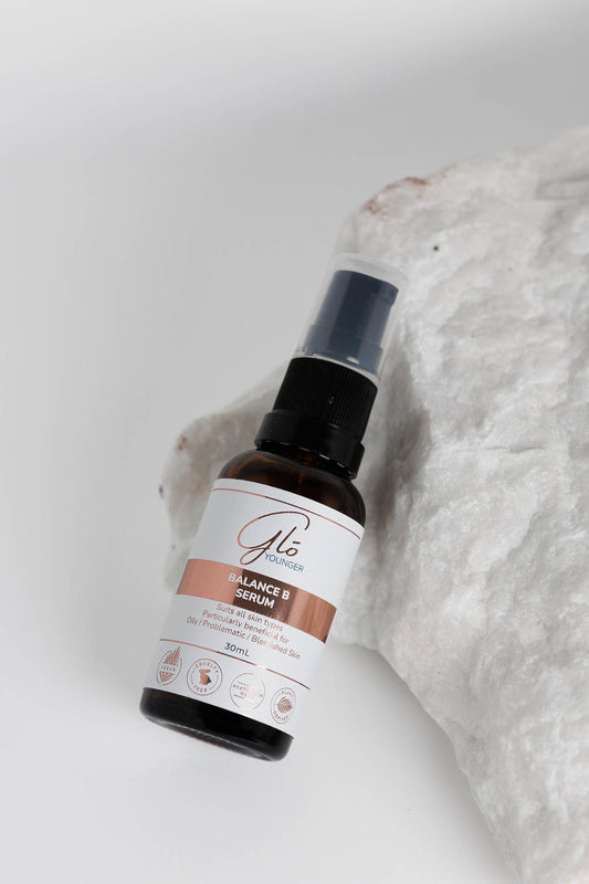 Glo Younger Balance B Serum bottle on stone
