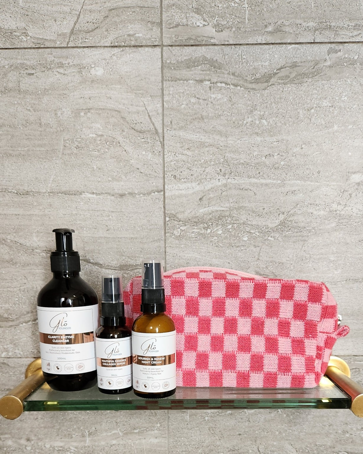 Pink checkerboard cosmetic bag with Glo Younger skincare