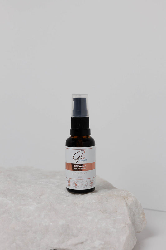 Glo Younger Renewal A Oil Serum bottle on stone